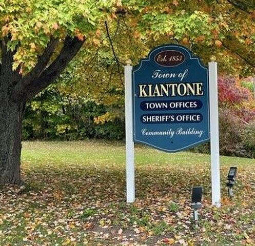 Town of Kiantone sign under in tree in fall